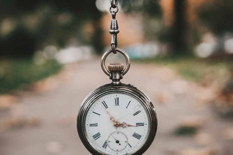 Magnifying loupe examining a watch dial closely