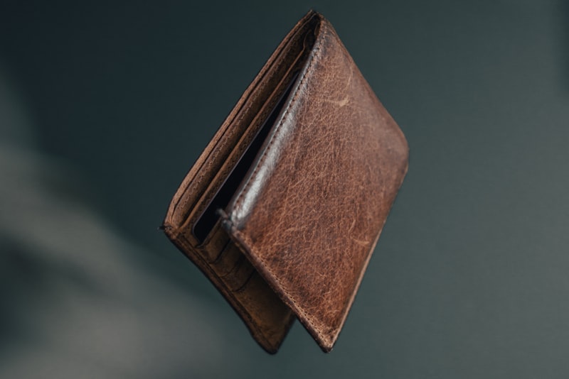 Slim leather wallet beside a traditional bifold